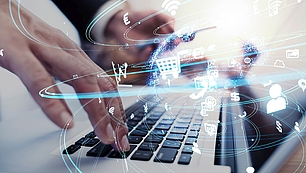 E-Commerce Logistics Hands use a laptop with digital logistics icons for serial number tracking with mySPECTRA NMS
