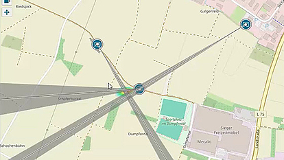 Map view with direction lines intersecting to geolocate an RF emission source.