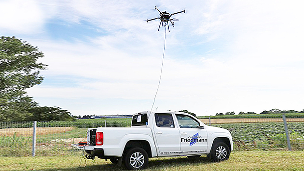 AMU drone tethered to a pick-up truck for continuous power and stable data connection during extended operations.
