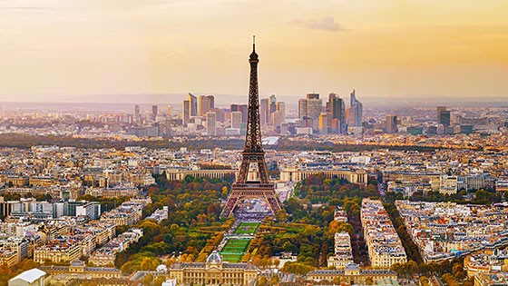 Iconic Eiffel Tower at sunset. The Eiffel Tower and surrounding cityscape during sunset in Paris. Title: Iconic Eiffel Tower at sunset.